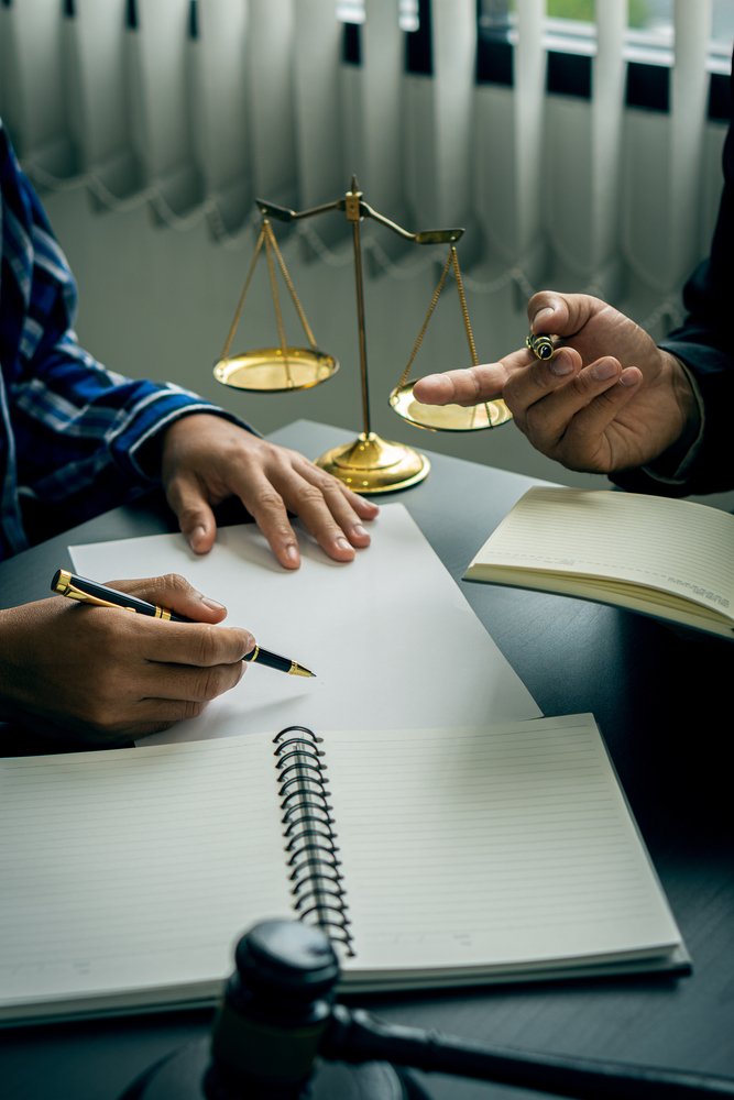 Lawyers,Work,With,Clients,At,Their,Desks.,Consultation,Between,A